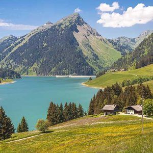 beautiful view of a lake surrounded by mountains in longrin lake and dam switzerland, swissalps